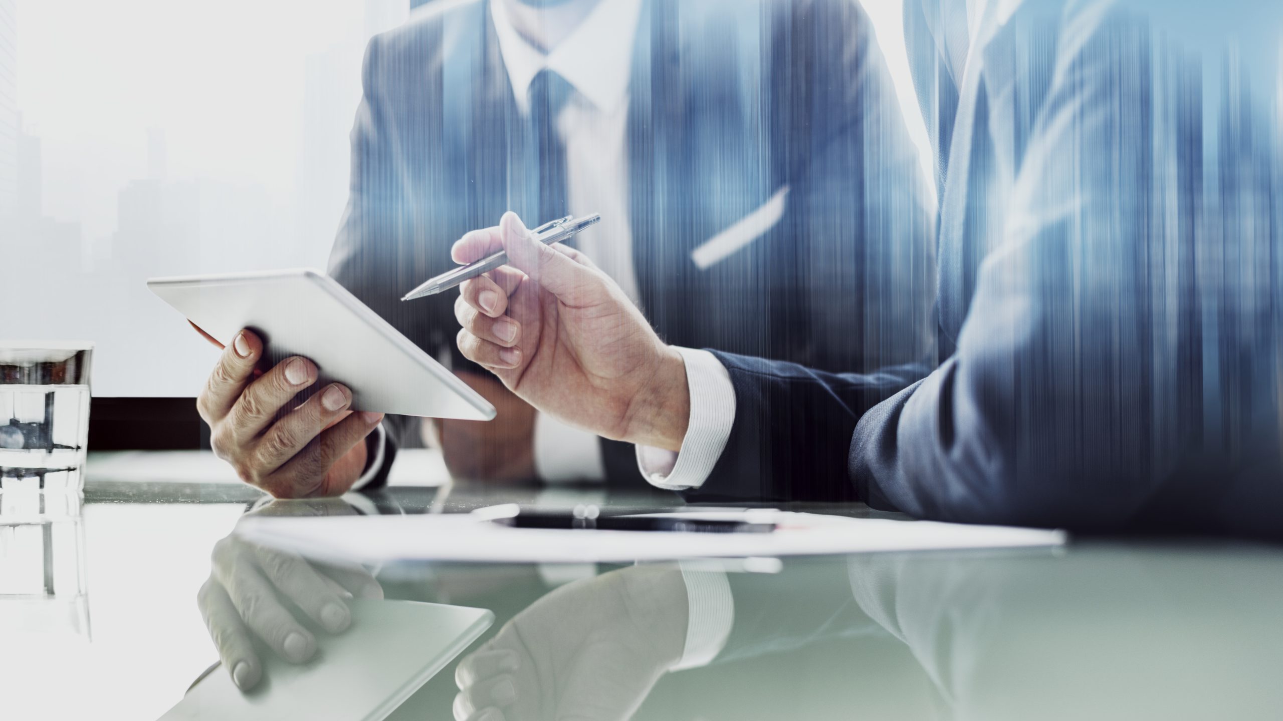 Home corporate businessmen working tablet office scaled.jpg